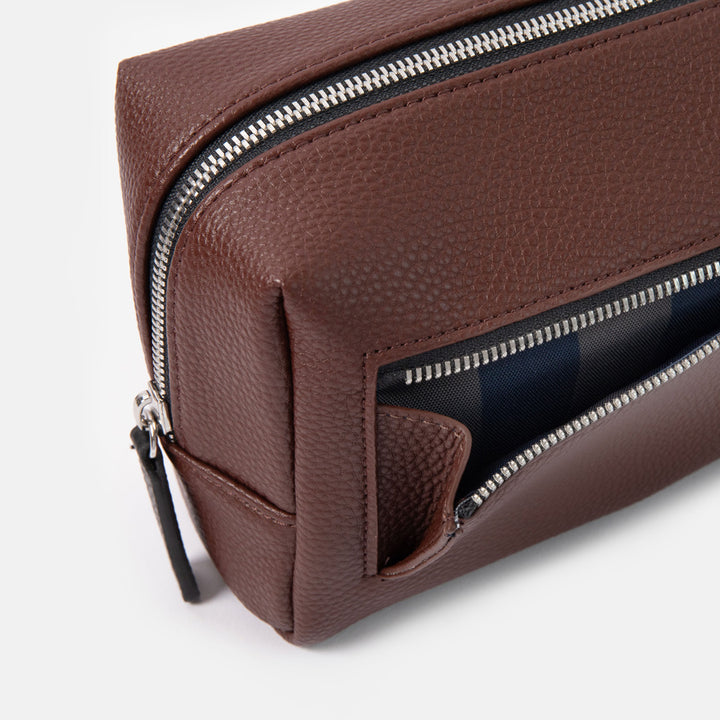 dark purple small ash bag with silver zip and black zip pulls and blue and green internal lining