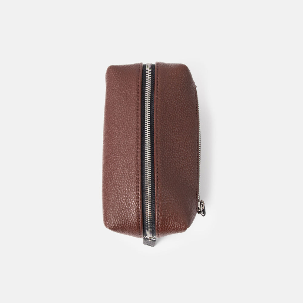 dark purple small ash bag with silver zip and black zip pulls on a white background