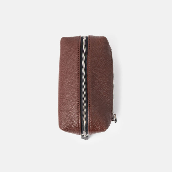 dark purple small ash bag with silver zip and black zip pulls on a white background