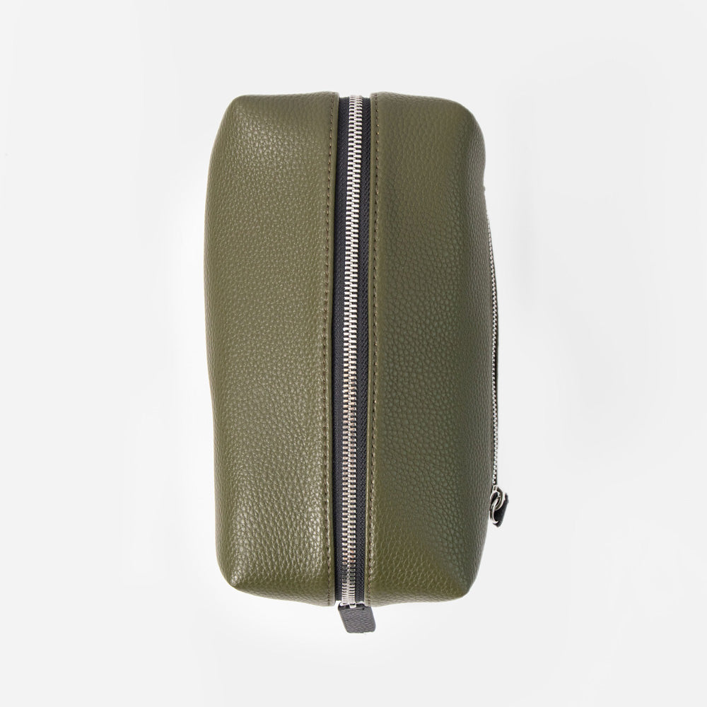 khaki green leather look wash bag with silver zipped closure on a white background