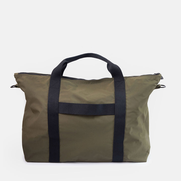 dark green weekend travel bag with black grab handles and suitcase strap