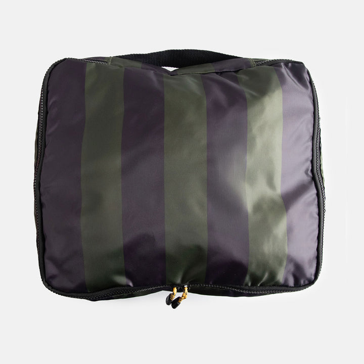 Striped packing cube with navy blue and green stripe pattern on a white background