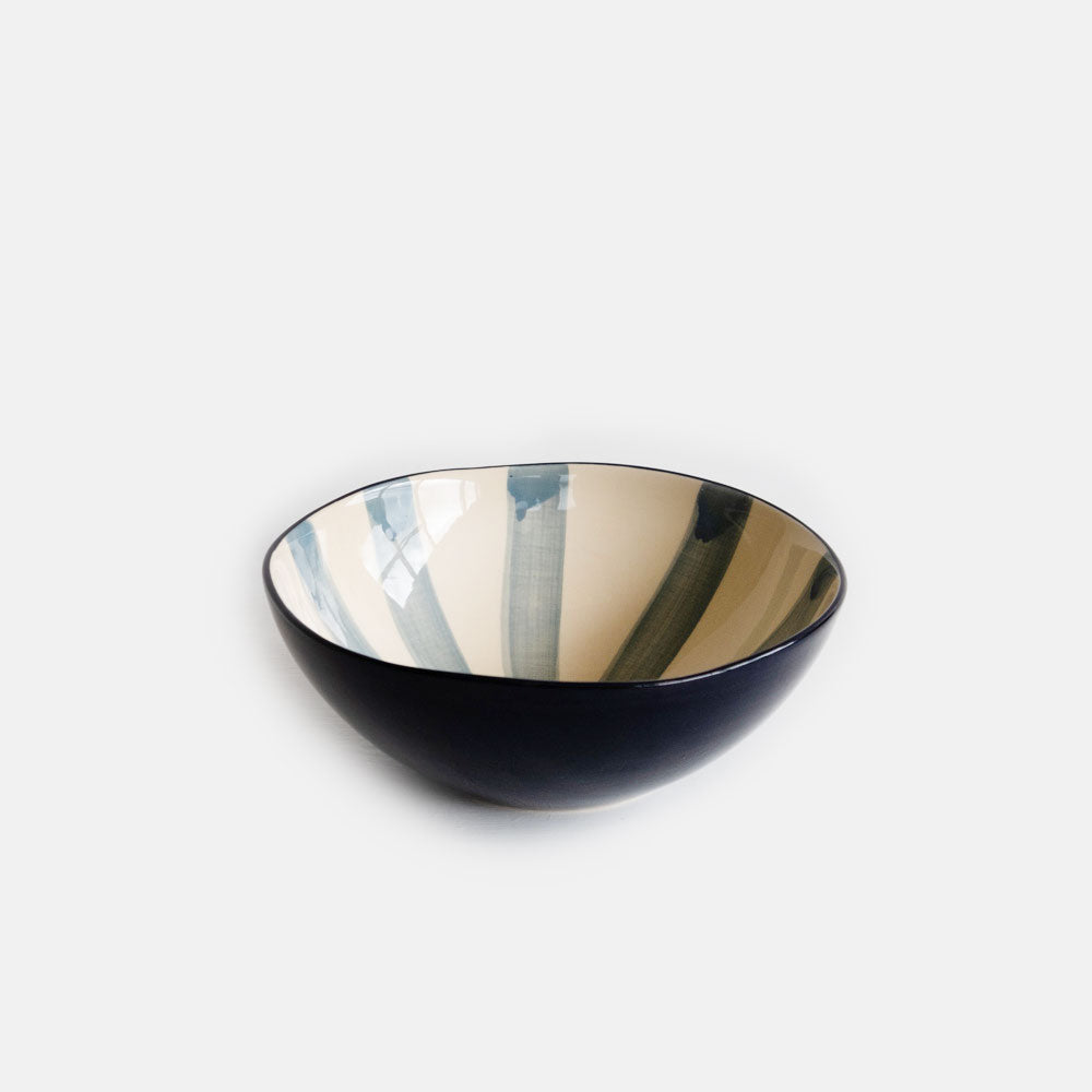 hand made ceramic bowl with blue candy striped inner and hand painted blue outer