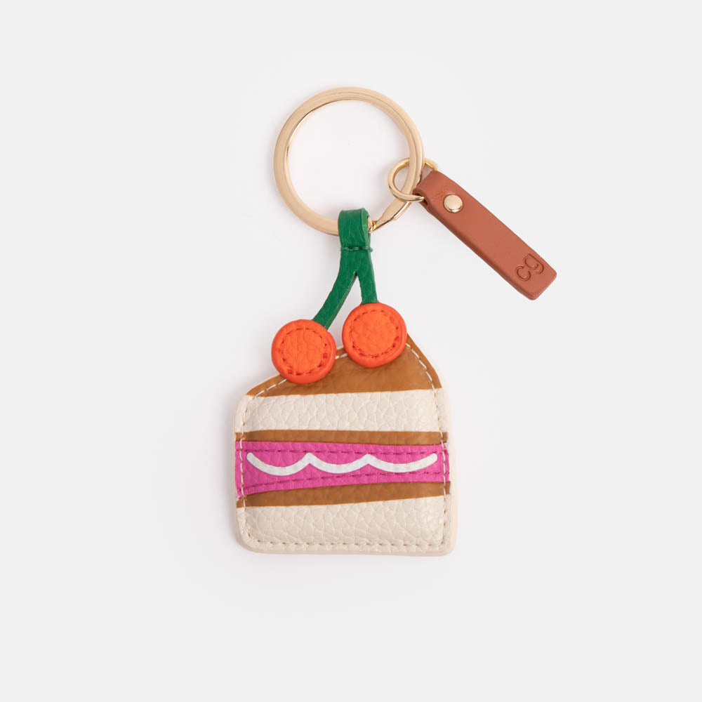 slice of cake with cherries on top padded leather look keyring