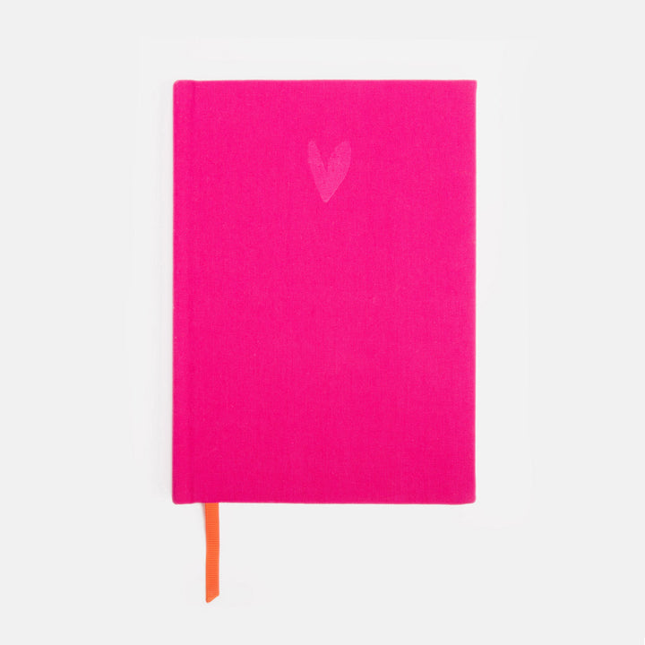Pink notebook with a heart design on a white background