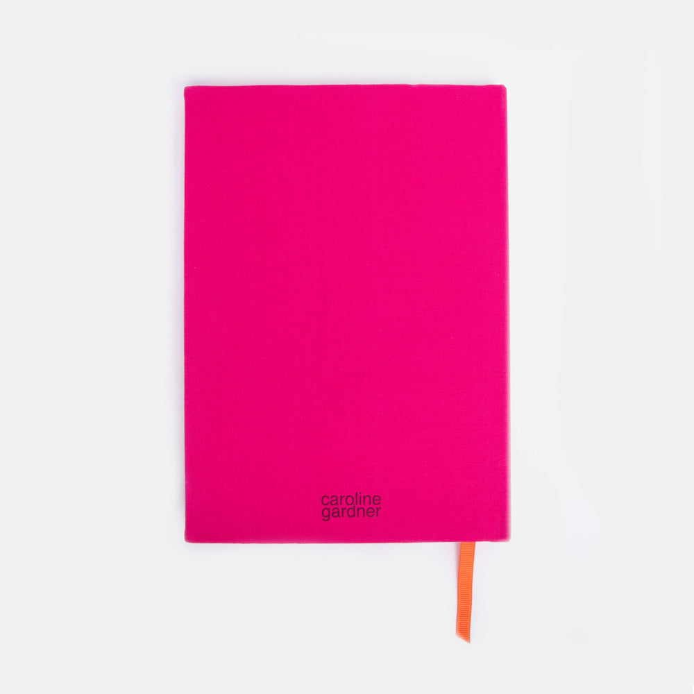 Pink notebook with orange marker ribbon on a white background