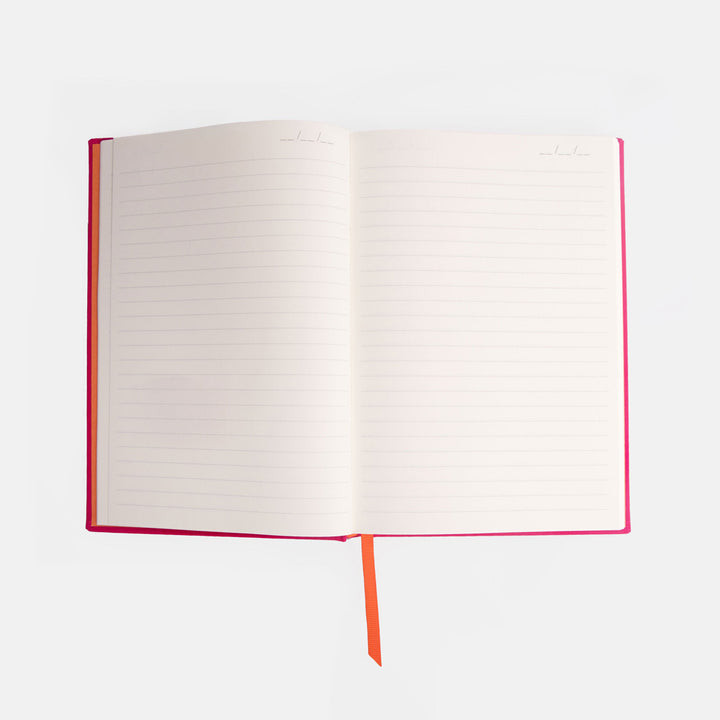 Open notebook with red binding on a white background