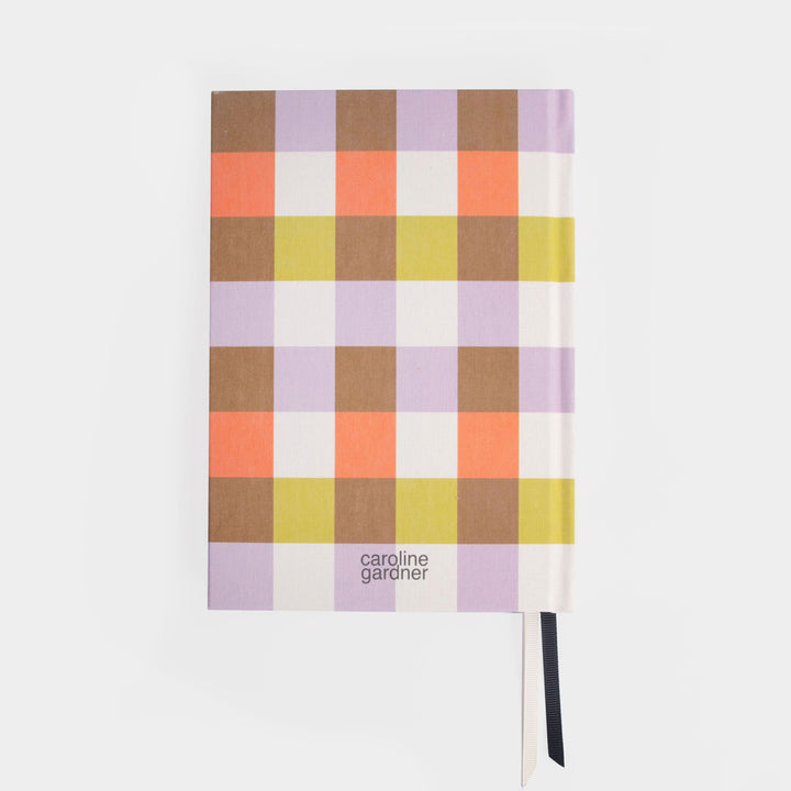 Notebook with a colorful checkered design on a white background