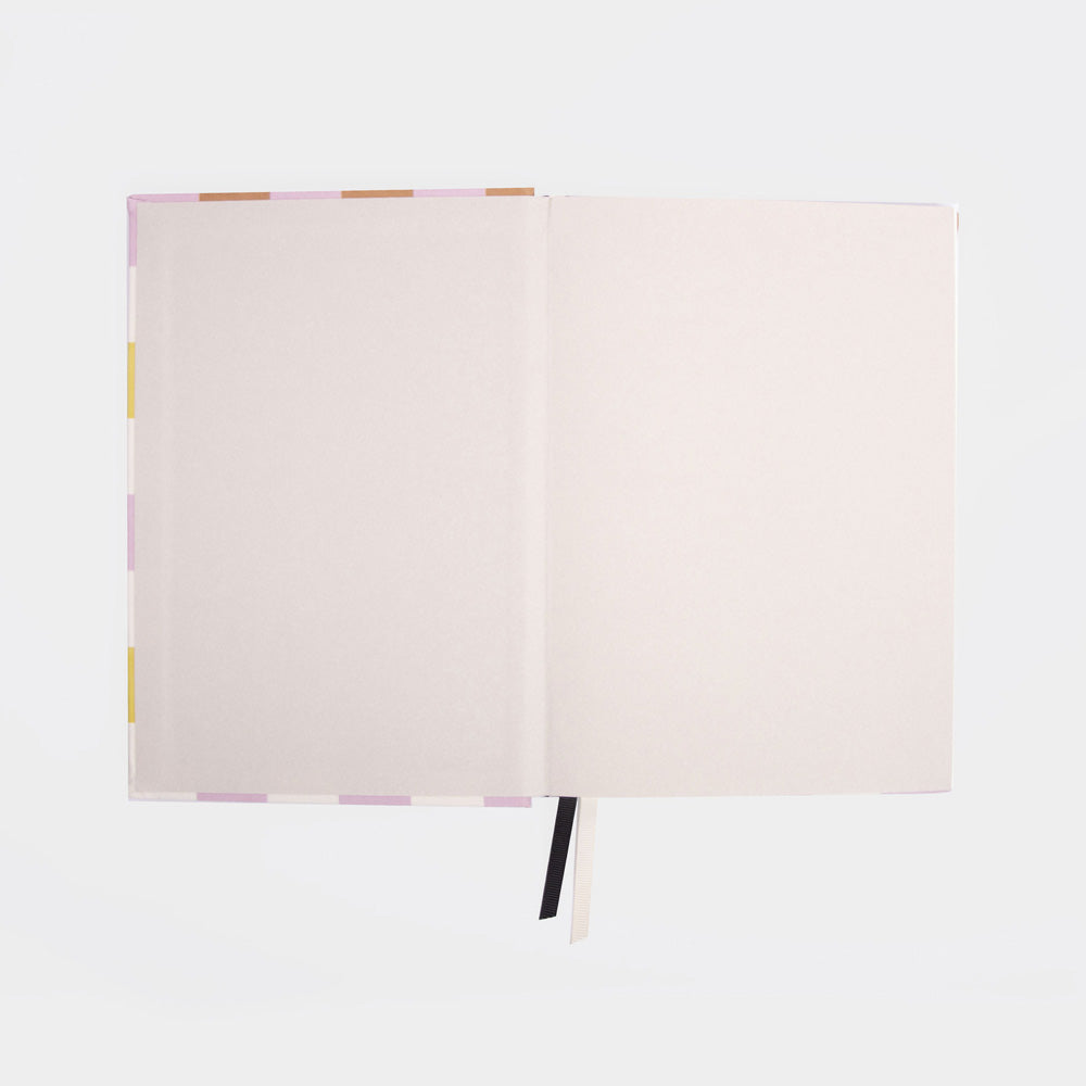 open notebook inside cover on a light grey backgrouynd