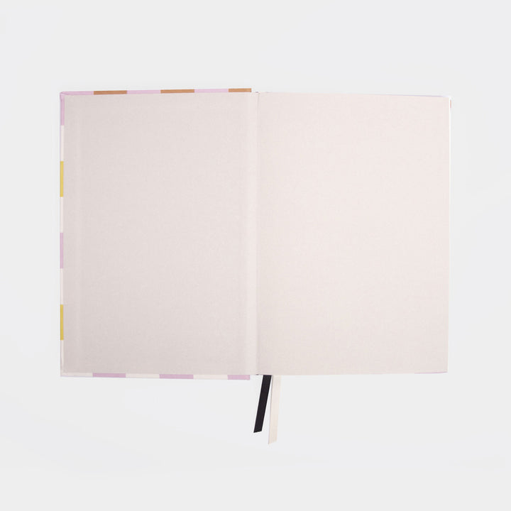 open notebook inside cover on a light grey backgrouynd