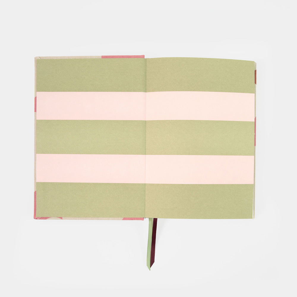 A hardcover notebook with alternating horizontal stripes of sage green and light pink, shown open on a clean white background.