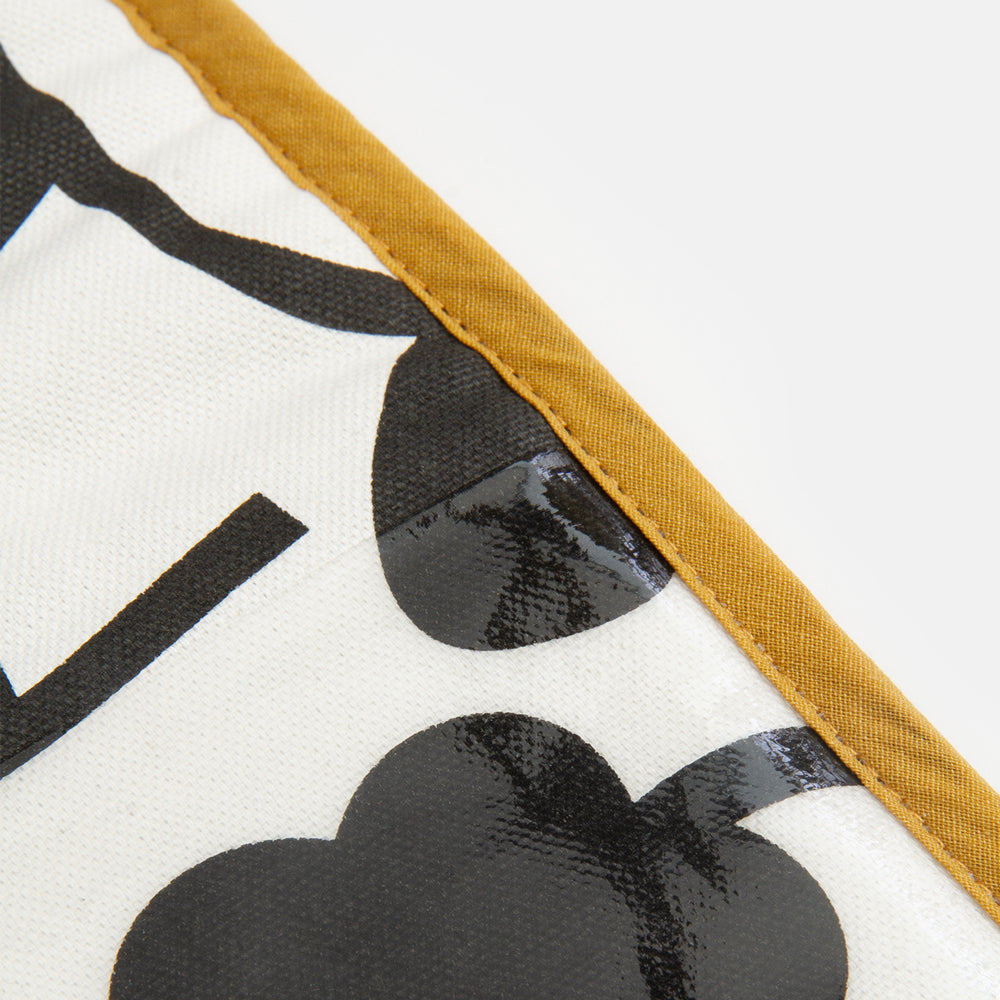 black and white monochrome floral print oven gloves with mustard yellow trim