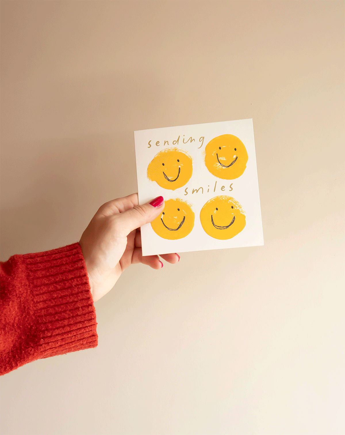 gif of hand holding a rotating selection of birthday and greetings cards