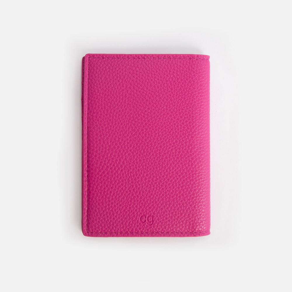 back of bright pink passport holder