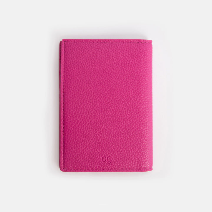 back of bright pink passport holder
