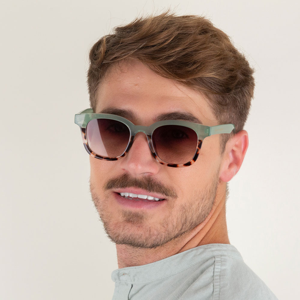 green and tortoiseshell round frame sunglasses with brown lenses