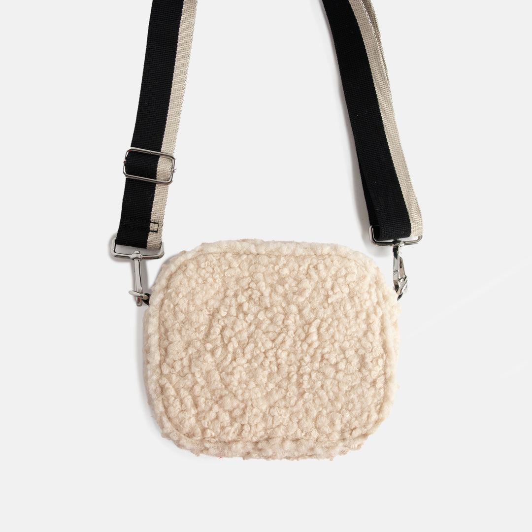 cream synthetic borg camera bag with silver zip and hardware, monochrome webbing adjustable straps and spot print lining