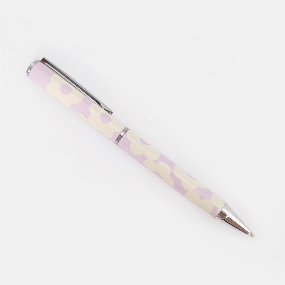 Pen with a lilac and white flower pattern on a white background
