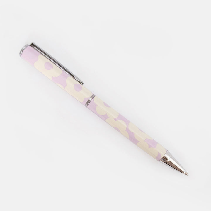 Pen with a lilac and white flower pattern on a white background