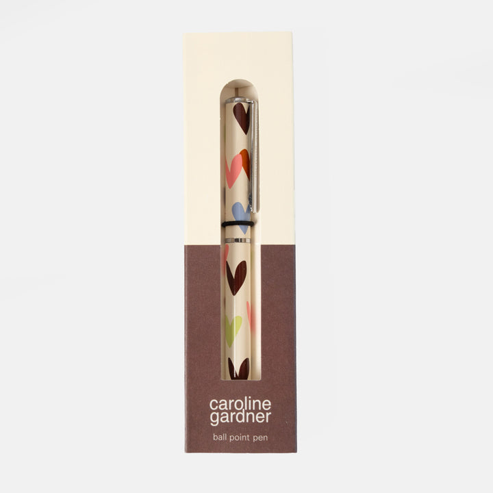 Caroline Gardner ball point pen in its original packaging, featuring a cream and brown box with a clear window showing the pen inside.