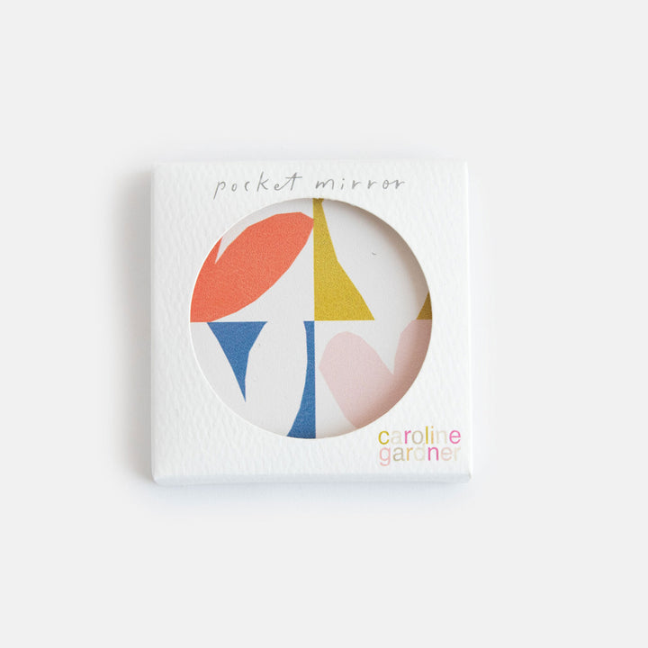 printed leather look PU square compact pocket mirror in a multi coloured hearts print, with 2 mirrors and magnetic fastening