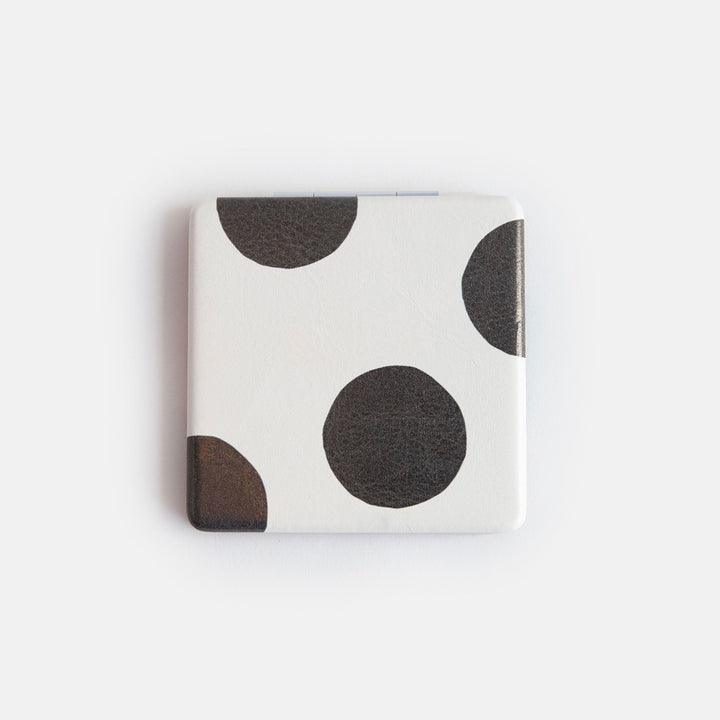 printed leather look PU square compact pocket mirror in a black and white spot print on the pront and black and brown spot on the back, with 2 mirrors and magnetic fastening