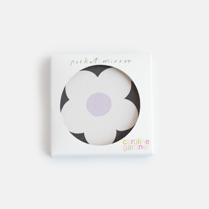 printed leather look PU round compact pocket mirror in a cream flower over charcoal print, with 2 mirrors and magnetic fastening