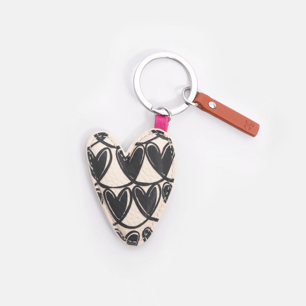 Heart-shaped key ring with black looped hearts pattern on a white background