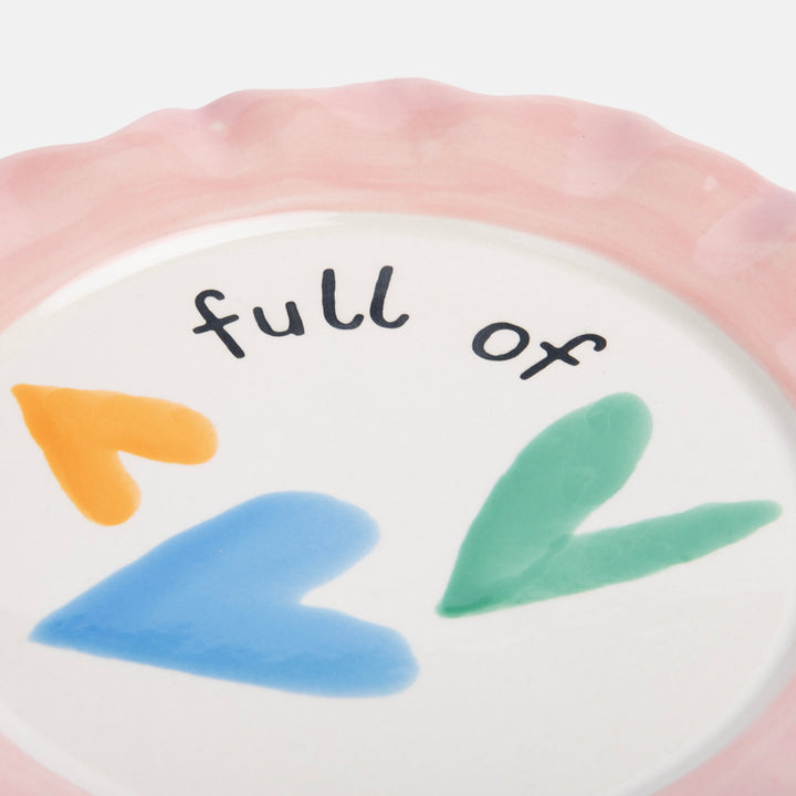 hand painted glazed stoneware plate with colourful hearts design and pale pink scalloped edge