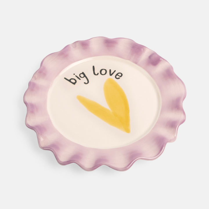 hand painted glazed stoneware plate with yellow heart design and purple scalloped edge