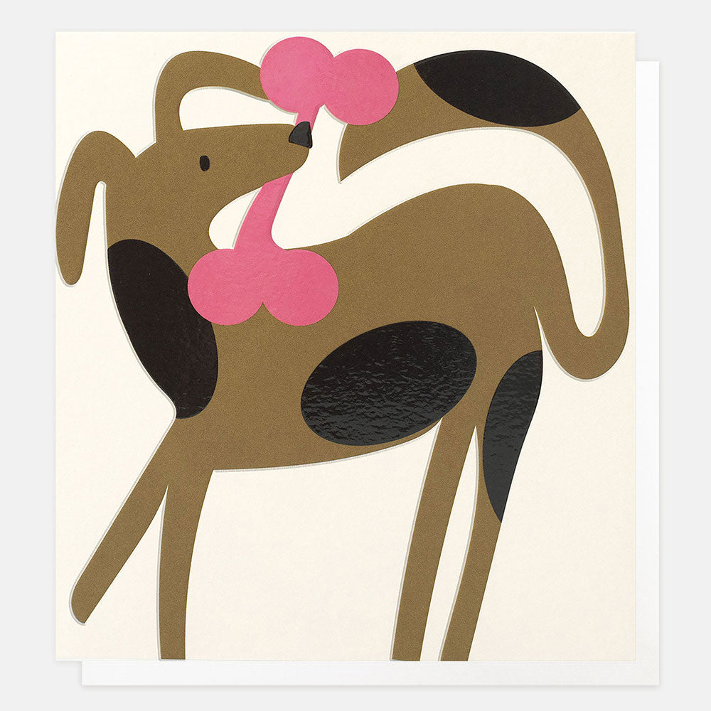 A greetings cards with a dog illustration on a cream card, with a pink bone-shaped nose and black patches on a tan body, shown against a light gray background.