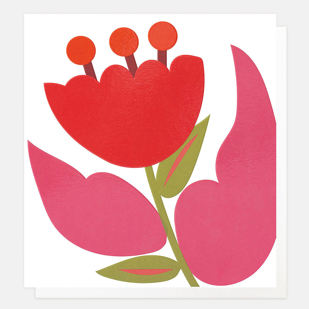 A minimalist floral greetings card featuring a bold red flower with three orange circles on its stem, surrounded by pink leaves and green accents on a white background.