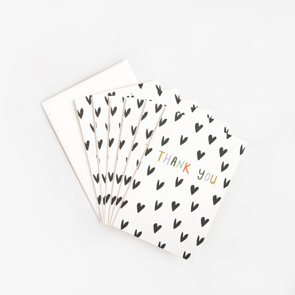 pack of  thank you cards featuring black hearts on a white background with the words 'thank you'