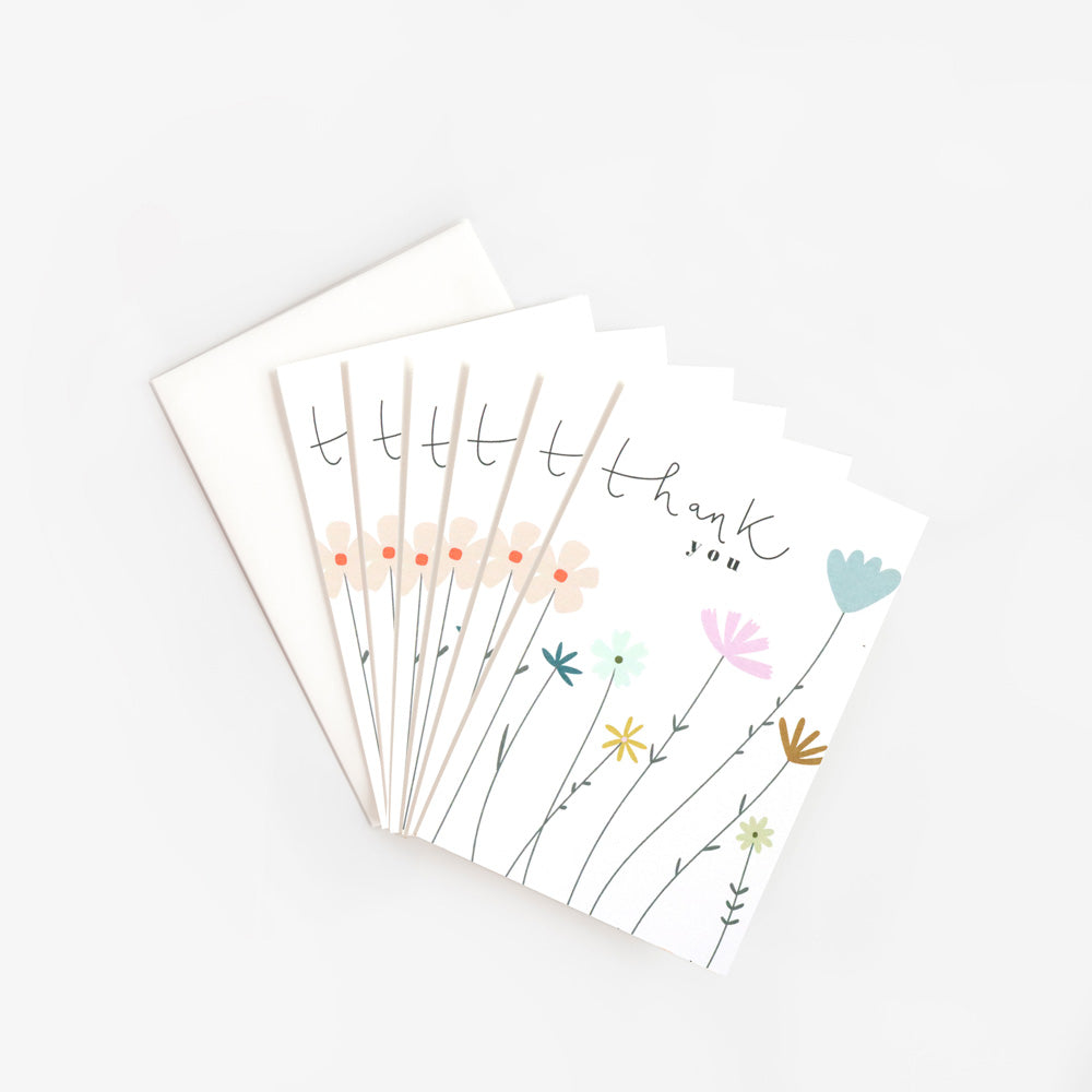 pack of 6 pastel coloured flowers thank you cards with the wording 'thank you'
