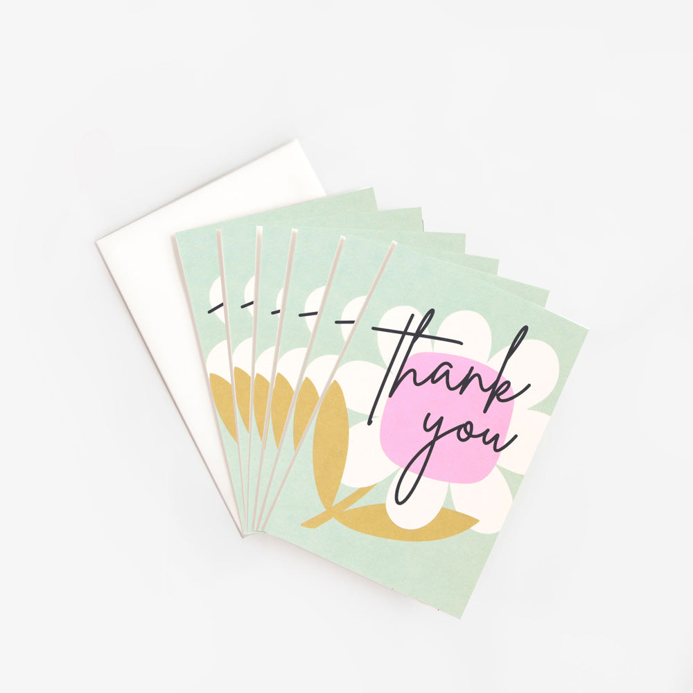 pack of 6 thank you cards with big pink & white flower on a light blue background and thank you text