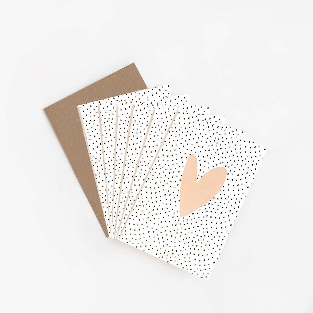 pack of 6 cards with pink heart on a black dotty background