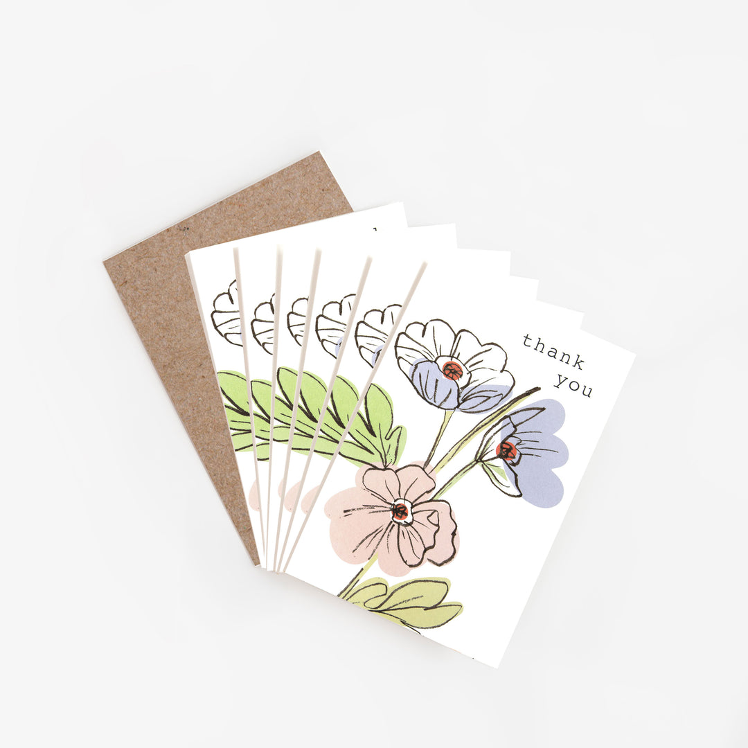 Set of floral cards with a 'thank you' message on a white background