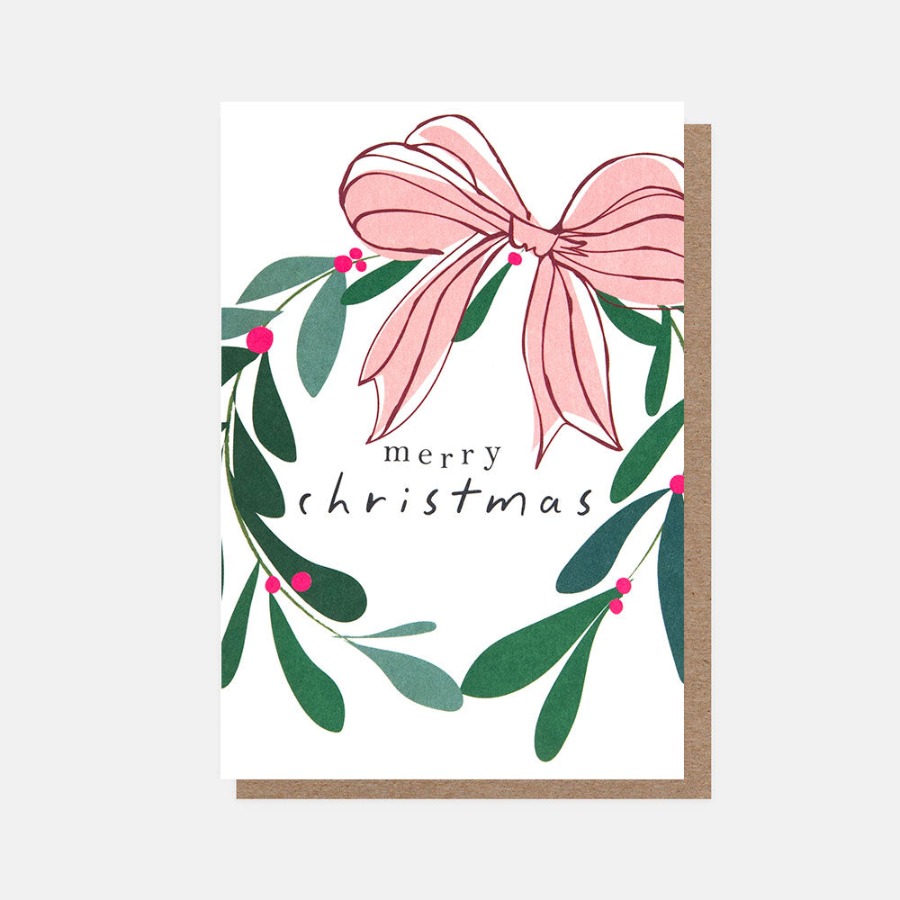 christmas card featuring a wreath of mistletoe with red berries and a pink bow and merry christmas text on a white background
