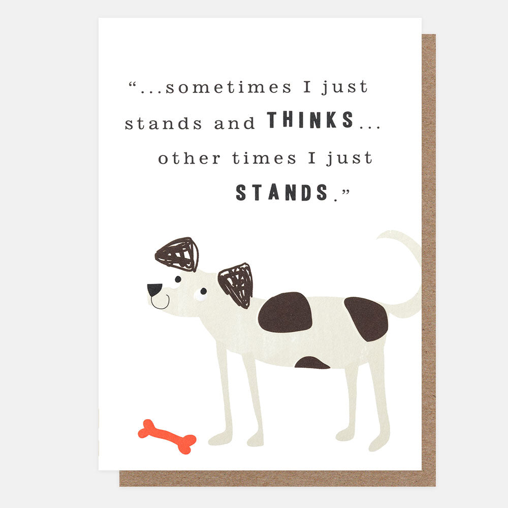 A white greeting card with a brown envelope behind it, featuring a cute illustrated dog with dark brown patches and a small red bone. The card has a humorous quote printed in black text: “...sometimes I just stands and THINKS...other times I just stands".