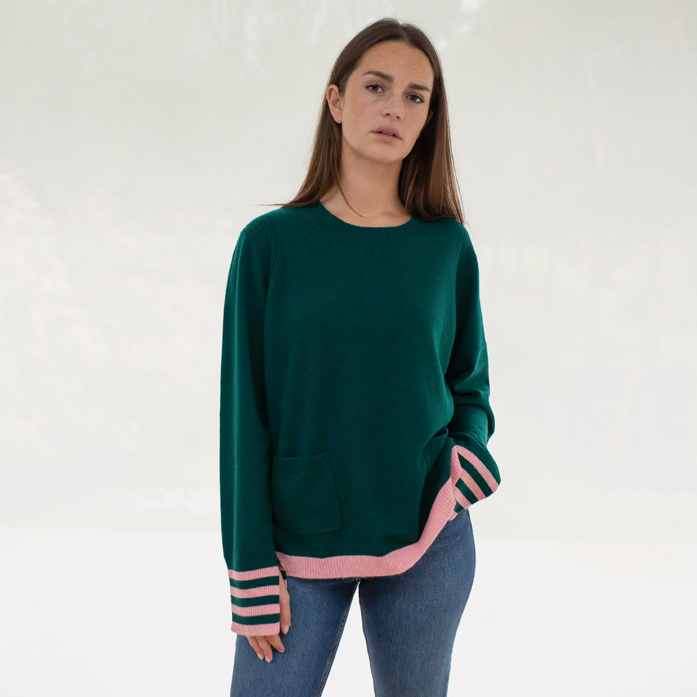 green pure cashmere crew neck jumper with pale pink waist trim and striped cuffs, made by Cocoa Cashmere