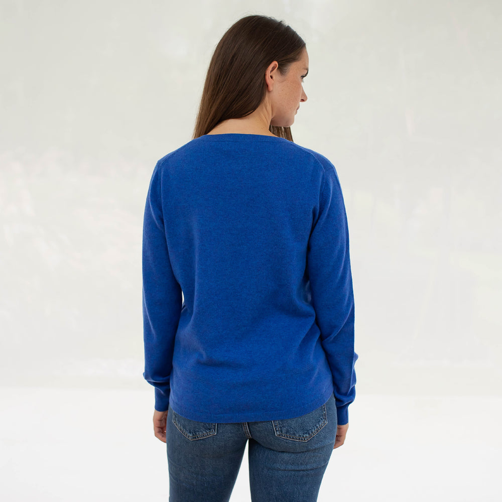 bright blue pure cashmere crew neck jumper with contrast pink stripe front pocket, made by Cocoa Cashmere