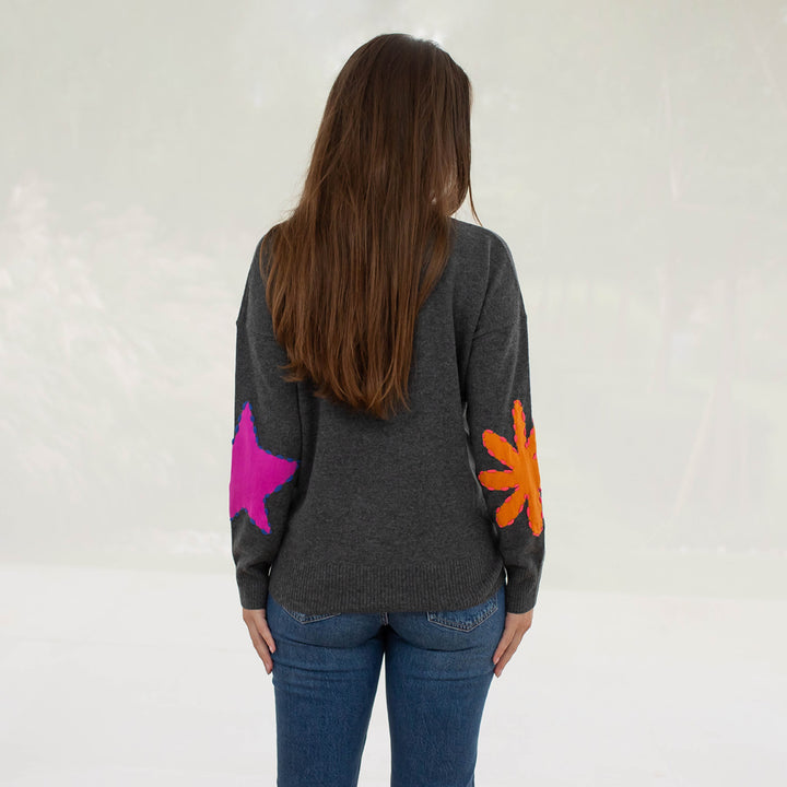 grey crew neck pure cashmere jumper with intarsia embroidered orange and pink shapes on elbows, made by Cocoa cashmere