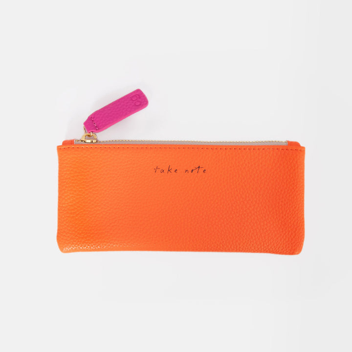 orange leather look pencil case with the slogan 'take note' on and a pink zip pull