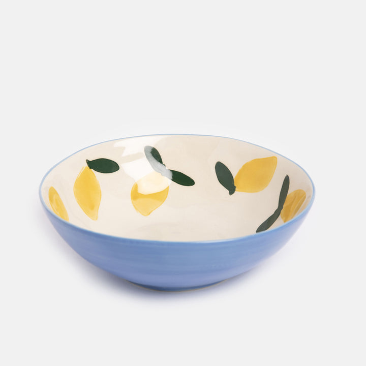 hand painted ceramic stoneware bowl with blue outer and yellow lemons design inside