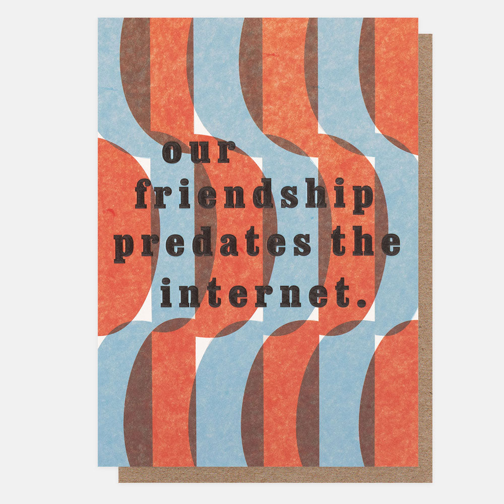 greetings cards featuring a red and blue geometric risograph style print with the text "our friendship predates the internet."
