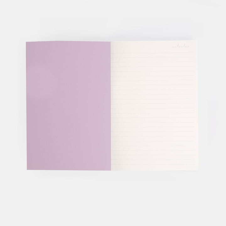 notebook inside cover with one lilac page and one white lined page