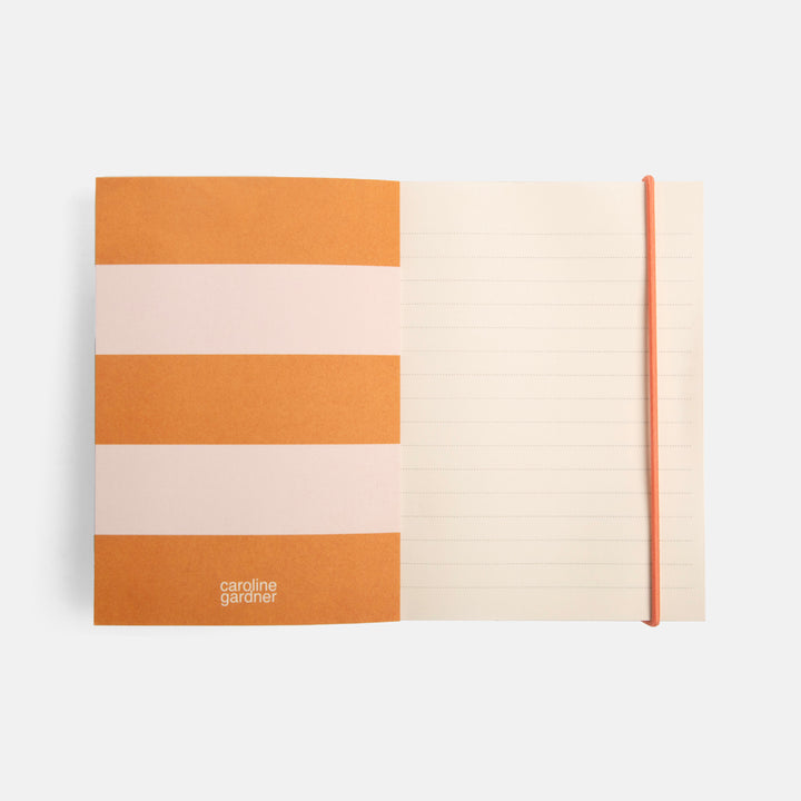 monochrome foliage print small soft cover notebook with pink & orange stripe inner