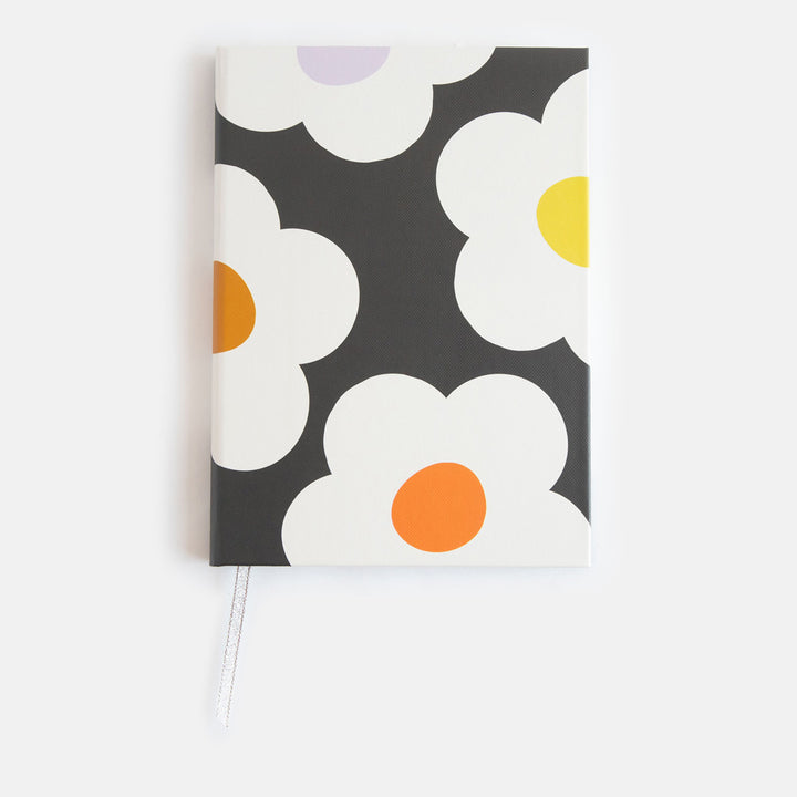 slim casebound hardcover notebook with cream flowers over a charcoal background design