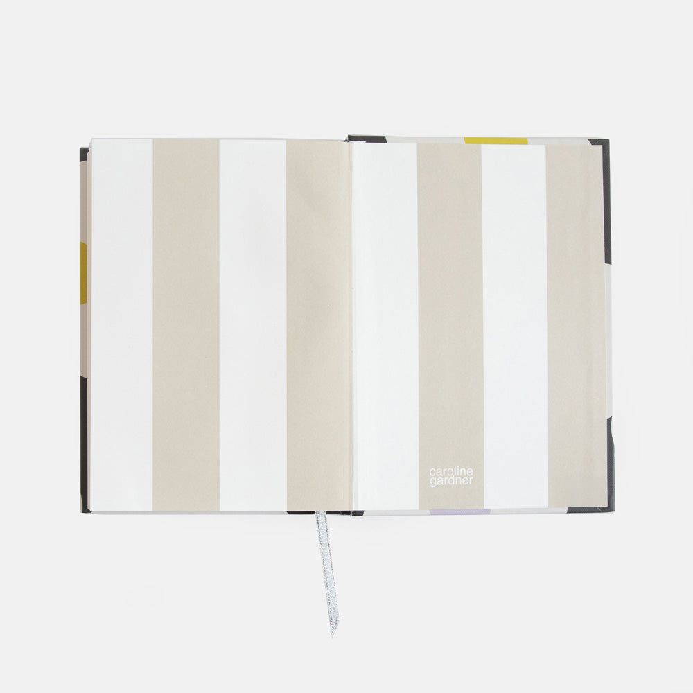 slim casebound hardcover notebook with cream and white striped lining and lined pages