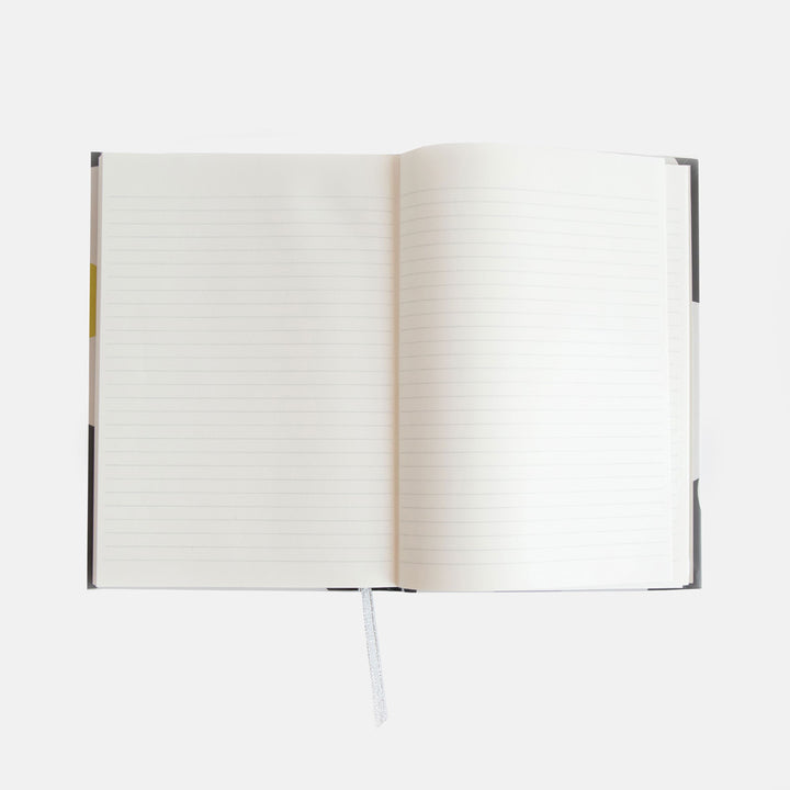 slim casebound hardcover notebook with cream and white striped lining and lined pages